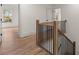 Staircase featuring wood and black iron railing leading to an upstairs hallway at 779-A Lynwood Se St, Atlanta, GA 30312