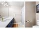 Bathroom offers large mirror, great lighting, modern fixtures, and a shower with decorative curtain at 1642 Reflections Trl, Powder Springs, GA 30127
