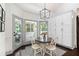 Bright dining area with backyard views, modern lighting, and built in cabinets at 1642 Reflections Trl, Powder Springs, GA 30127
