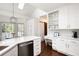 Modern kitchen featuring quartz countertops, white cabinets, and stainless steel appliances at 1642 Reflections Trl, Powder Springs, GA 30127