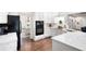 Beautifully updated kitchen with marble countertops and black appliances at 1642 Reflections Trl, Powder Springs, GA 30127