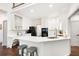 Bright kitchen with white cabinets, a marble countertop, and stainless steel appliances at 1642 Reflections Trl, Powder Springs, GA 30127