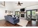 Bright living room with high ceilings, stone fireplace, hardwood floors, and comfortable seating at 1642 Reflections Trl, Powder Springs, GA 30127