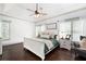Bright and airy main bedroom with hardwood floors, tray ceiling, and neutral decor at 1642 Reflections Trl, Powder Springs, GA 30127