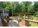 Back deck with outdoor pergola, hammock, and in-ground pool offers a great entertainment space at 1642 Reflections Trl, Powder Springs, GA 30127