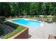 In-ground pool with lounge chairs offering an inviting space for relaxation and recreation at 1642 Reflections Trl, Powder Springs, GA 30127