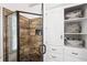 Close-up of the main bathroom's shower with custom tile work and built-in niche at 1642 Reflections Trl, Powder Springs, GA 30127