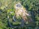 Expansive aerial view of the home nestled among lush greenery, offering both privacy and a serene natural setting at 1730 Etchison Spur, Loganville, GA 30052