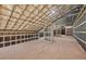Spacious attic featuring a metal frame and insulation, providing a blank canvas for customization at 1730 Etchison Spur, Loganville, GA 30052