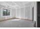Unfinished bedroom with window and concrete floors, ready for customization in this new home at 1730 Etchison Spur, Loganville, GA 30052