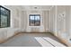Spacious unfinished bedroom is filled with natural light from window, awaiting personal touch at 1730 Etchison Spur, Loganville, GA 30052