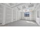 Unfinished bedroom features a ceiling with tray design and one window for natural light at 1730 Etchison Spur, Loganville, GA 30052