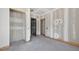 Unfinished room featuring trim detail and doorways to other rooms in the home at 1730 Etchison Spur, Loganville, GA 30052