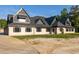 Brick home with striking roofline and many windows, set on a large lot ready for landscaping at 1730 Etchison Spur, Loganville, GA 30052