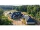 Home exterior featuring well-maintained grounds, complemented by a spacious side yard and auxiliary structure at 1730 Etchison Spur, Loganville, GA 30052