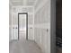 Bright hallway features an open doorway leading to another room, awaiting finishing touches at 1730 Etchison Spur, Loganville, GA 30052
