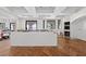 Spacious, bright kitchen with herringbone wood flooring, large island, and windows at 1730 Etchison Spur, Loganville, GA 30052
