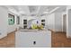 Spacious kitchen with a large island, hardwood floors, and modern ceiling lights at 1730 Etchison Spur, Loganville, GA 30052