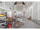 Living room during construction phase, showcasing tall ceilings, arched doorways and fireplace at 1730 Etchison Spur, Loganville, GA 30052