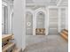 Living room showcasing arched doorways, a pillar and the entrance to the stairway at 1730 Etchison Spur, Loganville, GA 30052
