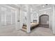 Spacious open area showcasing the stairway, pillars and arched doorways at 1730 Etchison Spur, Loganville, GA 30052