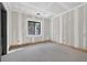 Spacious unfinished room offers bright sunlight and an opportunity to create a personalized space at 1730 Etchison Spur, Loganville, GA 30052