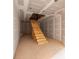 Staircase shows wood stairs under construction with primed walls and ceiling at 1730 Etchison Spur, Loganville, GA 30052