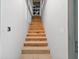 Stairway with unfinished wood steps and drywall walls leading to the next level at 1730 Etchison Spur, Loganville, GA 30052