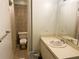 Bathroom with a cream sink and vanity and a toilet in a separate room at 2641 Old Norcross Rd, Tucker, GA 30084