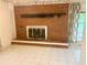 Living area showcases a brick fireplace with an inviting hearth and classic mantle that add warmth to the room at 2641 Old Norcross Rd, Tucker, GA 30084