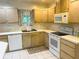 Functional kitchen with white appliances and plenty of storage at 2641 Old Norcross Rd, Tucker, GA 30084