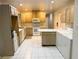 Kitchen includes ample cabinet space, white appliances and a convenient breakfast bar adjacent to the laundry area at 2641 Old Norcross Rd, Tucker, GA 30084