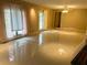 Spacious living room featuring tile flooring, natural light and a ceiling fan at 2641 Old Norcross Rd, Tucker, GA 30084