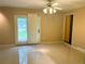 Open living space with tile flooring, natural light, and a ceiling fan at 2641 Old Norcross Rd, Tucker, GA 30084