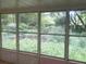 Sunroom featuring multiple windows, inviting natural light and offering views of the outdoor greenery at 2641 Old Norcross Rd, Tucker, GA 30084