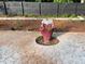 Backyard patio with patterned concrete, featuring landscaped planters, offering a private outdoor area at 284 Regal Dr, Lawrenceville, GA 30046