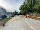 Large backyard with a patterned concrete patio, seating area, and lush landscaping, ideal for outdoor living at 284 Regal Dr, Lawrenceville, GA 30046