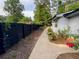 A cozy outdoor space with a dark wooden fence and well-manicured lawn at 284 Regal Dr, Lawrenceville, GA 30046