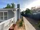 A paved path leads down the side of the house to a backyard featuring a privacy fence at 284 Regal Dr, Lawrenceville, GA 30046