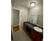 Bathroom with long vanity, sink and mirror at 284 Regal Dr, Lawrenceville, GA 30046