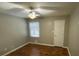 Bright bedroom featuring hardwood floors, natural light, and a ceiling fan at 284 Regal Dr, Lawrenceville, GA 30046