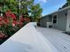The deck is equipped with outdoor seating and a great view of the beautiful landscaping at 284 Regal Dr, Lawrenceville, GA 30046