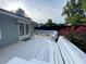 A bright deck features benches with lush landscaped yard at 284 Regal Dr, Lawrenceville, GA 30046