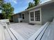 Bright deck with outdoor seating and charming French doors that lead into the house at 284 Regal Dr, Lawrenceville, GA 30046
