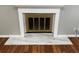 Close-up of the fireplace with white mantle and marble hearth at 284 Regal Dr, Lawrenceville, GA 30046