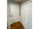 Welcoming foyer features stylish hardwood floors, a coat closet, and a neutral color palette at 284 Regal Dr, Lawrenceville, GA 30046