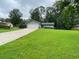 Well maintained home on large lot with a sprawling green lawn and an extended concrete driveway at 284 Regal Dr, Lawrenceville, GA 30046