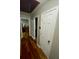Hallway featuring hardwood floors and white trim at 284 Regal Dr, Lawrenceville, GA 30046
