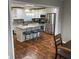 Updated kitchen with a granite-topped island, stainless appliances, and counter seating at 284 Regal Dr, Lawrenceville, GA 30046