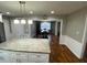 Bright eat-in kitchen featuring granite countertops, white cabinets, and stainless steel appliances at 284 Regal Dr, Lawrenceville, GA 30046